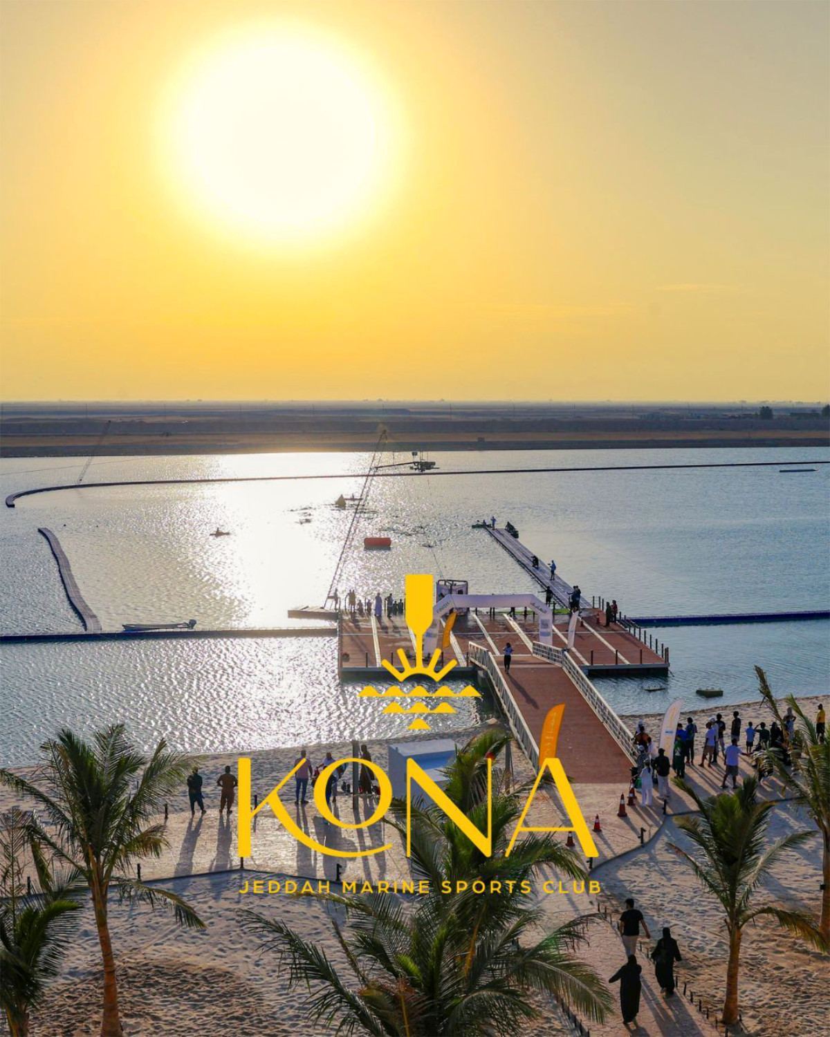 Kona Marine Sport Club’s lagoon, pier and cable park at sunset, overlaid with the Kona logo